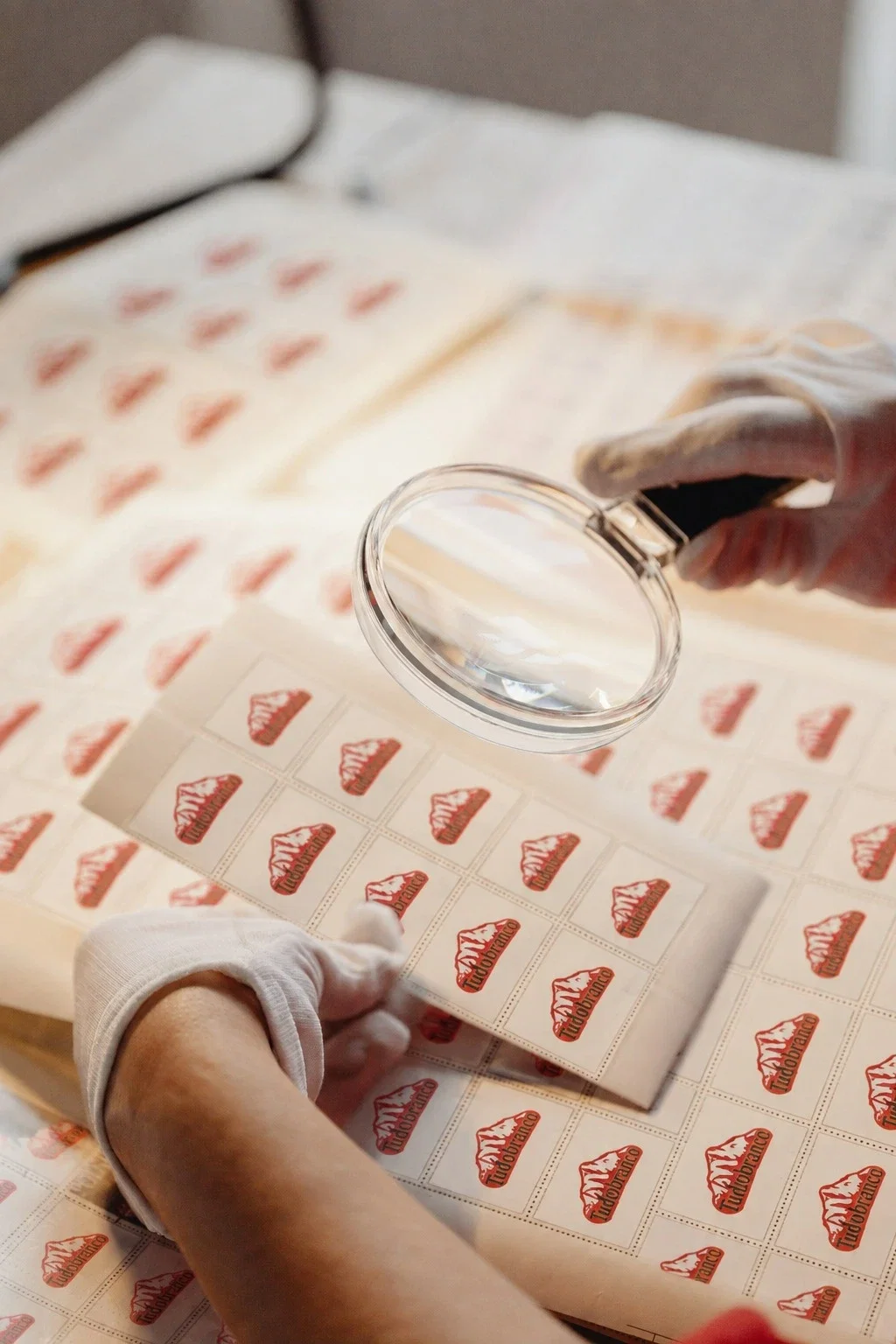 Quality control technician in a white coat inspecting a grain sample in a food laboratory