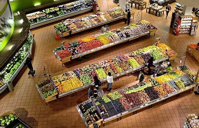 Fully stocked supermarket aisle with packaged food products