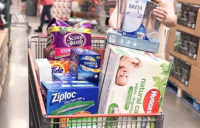 Shopping trolley filled with packaged consumer goods in a store