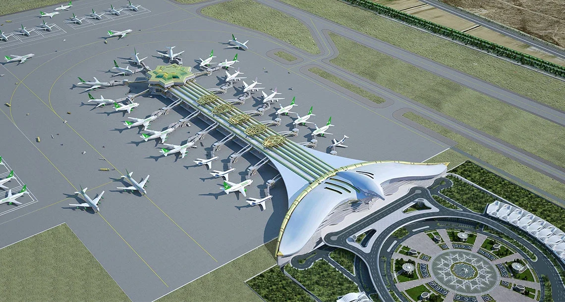 Havalimanının apron alanında park etmiş uçaklar ve terminal binası